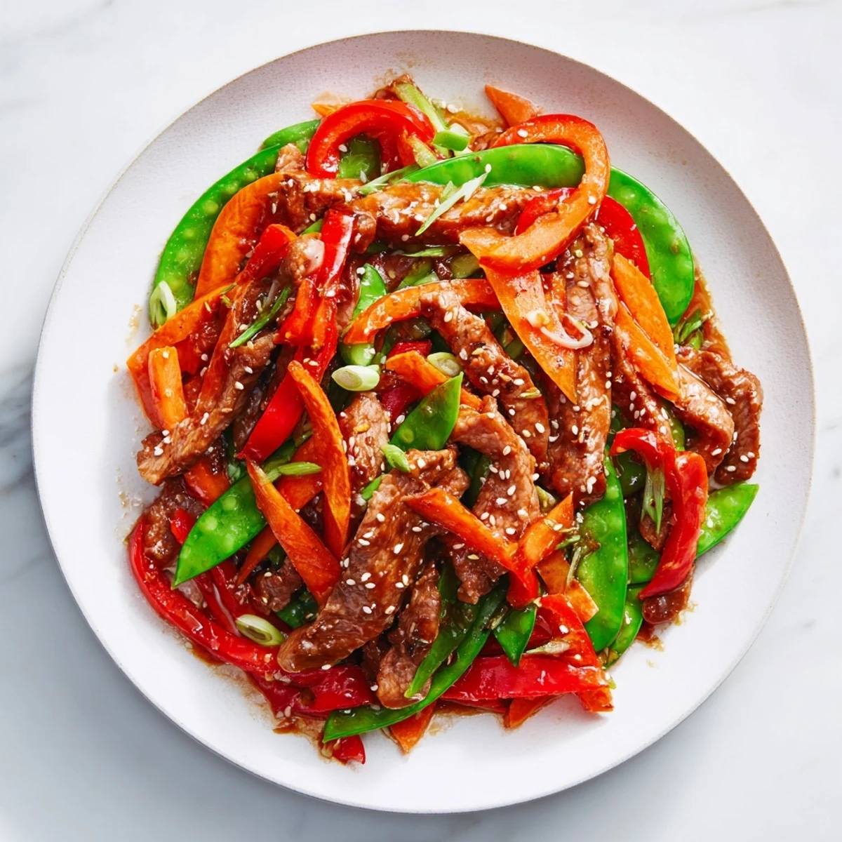 This delicious sweet teriyaki pork stir-fry boasts glistening pork and crisp vegetables cooked to perfection.