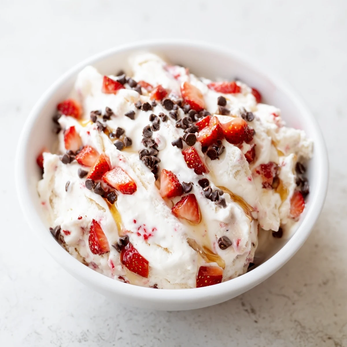 Homemade Cottage Cheese Ice Cream, smooth and rich, with a swirl revealing delicious fruit mix-ins.