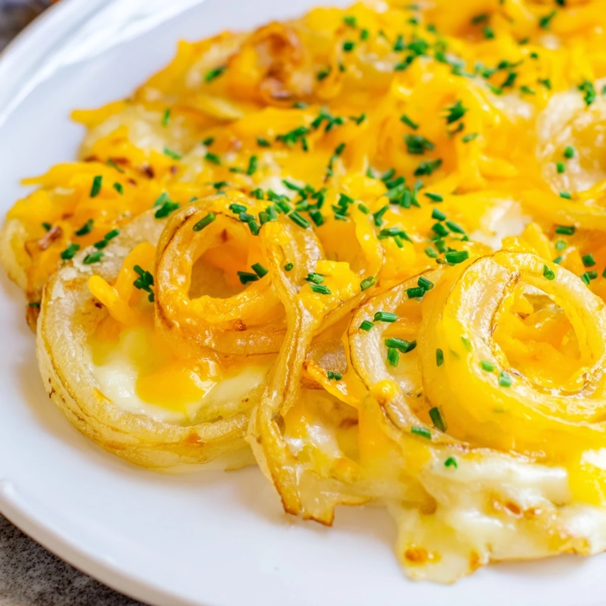 Golden-brown Crispy Onion Cheese Chips, a savory air-fried snack with melted cheddar and mozzarella.
