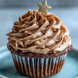 Velvety vanilla cupcakes crowned with rich, earthy terracotta-colored buttercream frosting perfected.