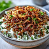 Top this Levantine Mujadara with crispy fried onions for a hearty vegetarian meal.