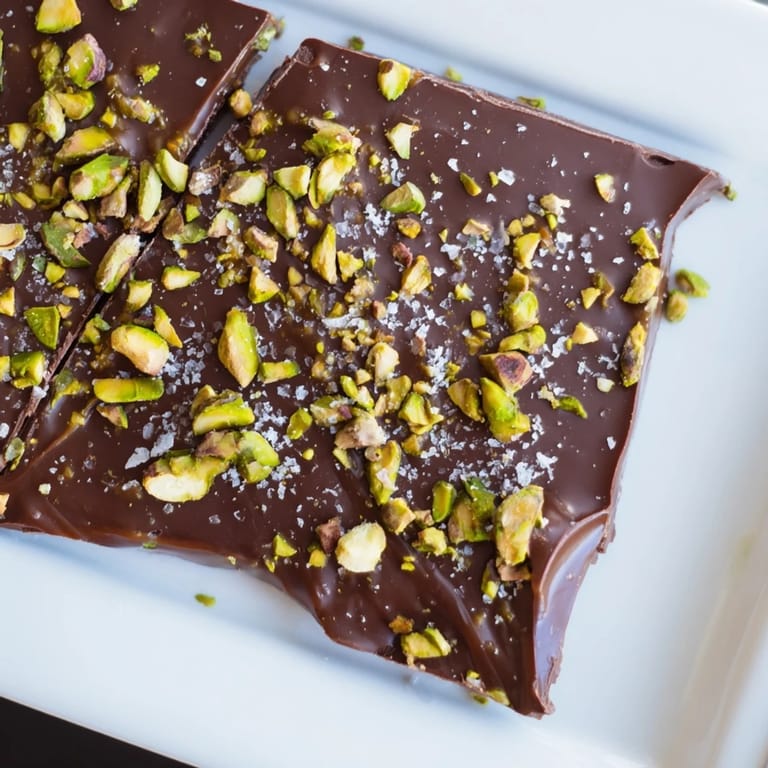 Close up view of the decadent pistachio salted caramel bark; a beautiful treat for any occasion.
