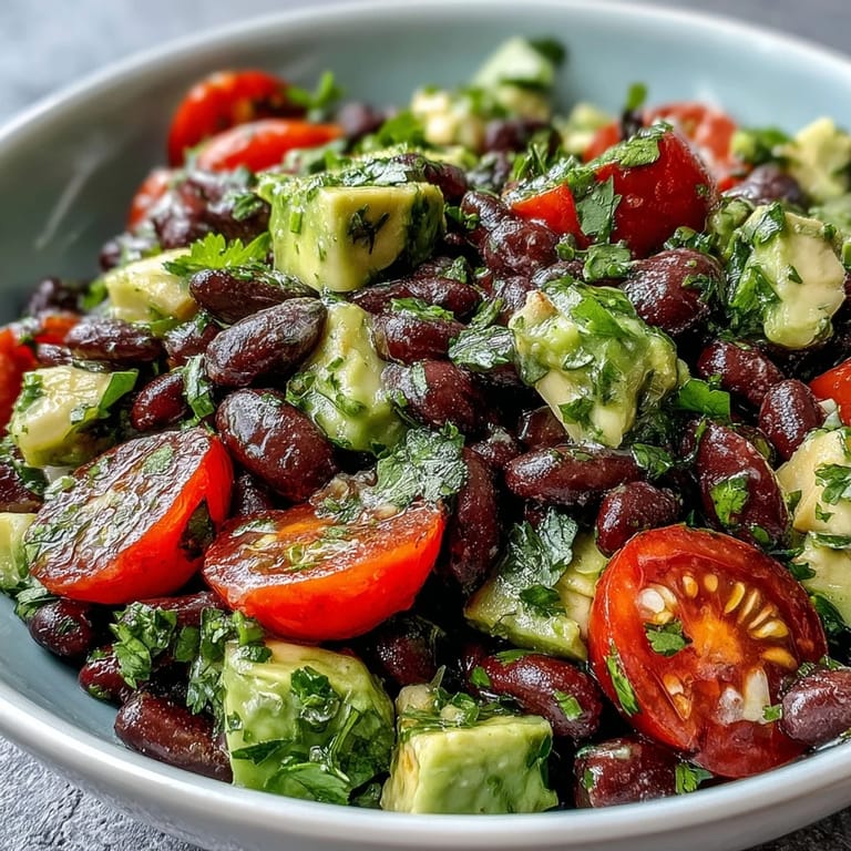 Colorful Black Bean and Veggie Bowl with sweet corn, black beans, and avocado, served in a rustic bowl for a healthy meal.