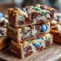 Chewy Cadbury Egg Cookie Bars with colorful pastel M&Ms, perfect for Easter dessert tables.  