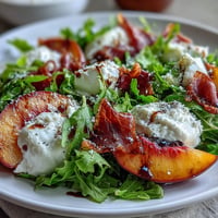 Creamy burrata, sweet peaches, and prosciutto star in this stunning summer salad.