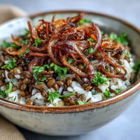 Levantine Mujadara with fluffy rice, tender lentils and crispy onions on top.